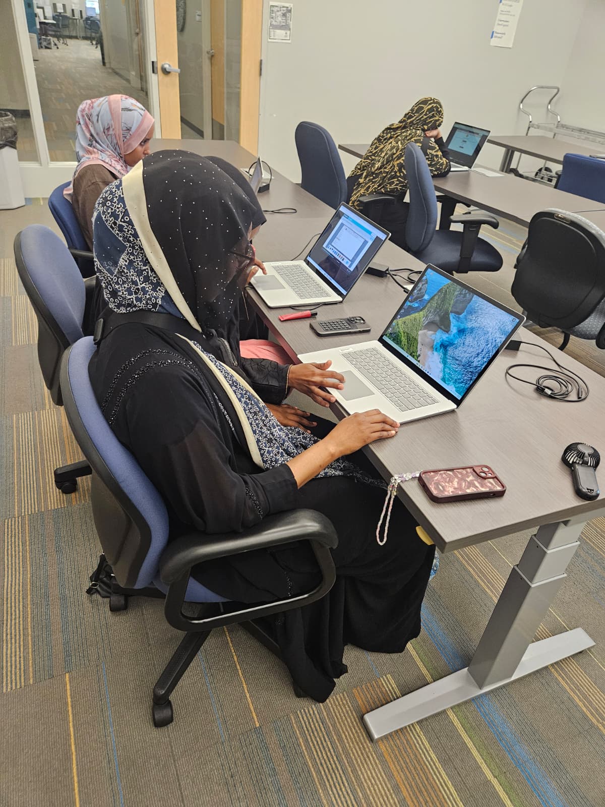 Participants working hands-on during a digital literacy session