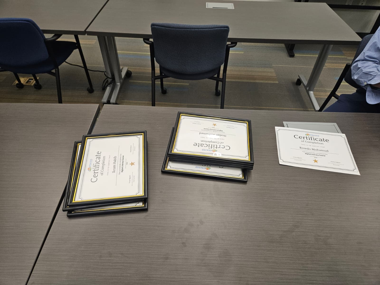 Framed certificates of completion prepared for program graduates